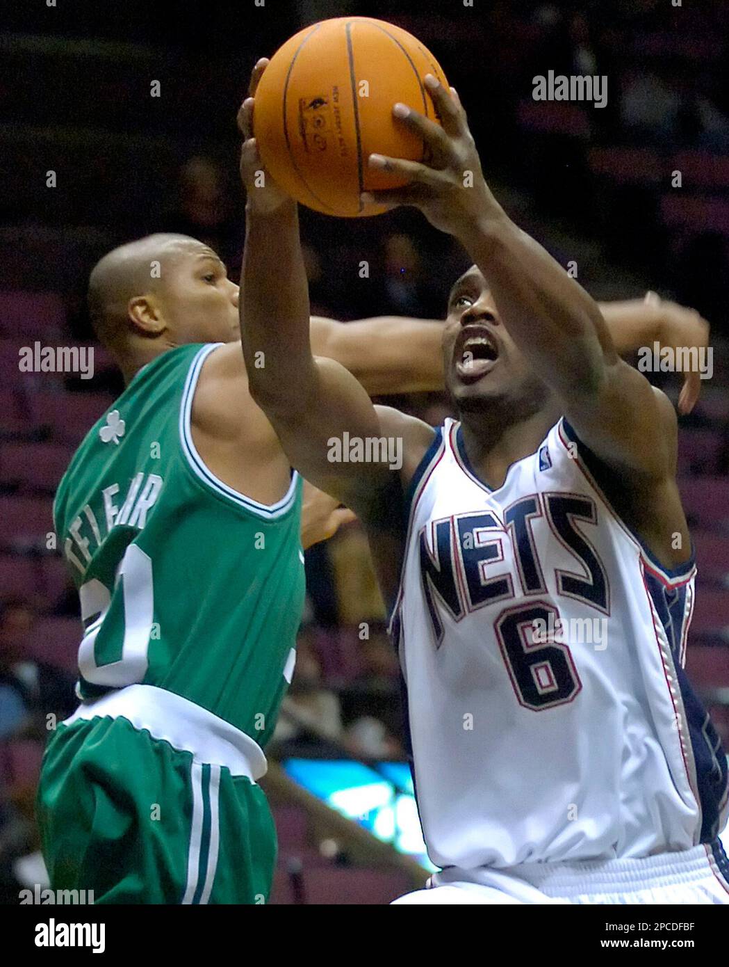New Jersey Nets' Awvee Storey , left, fouls Cleveland Cavaliers' Jeff  McInnis as they go for a loose ball in the first quarter of a preseason  game Monday, Oct. 18, 2004, in