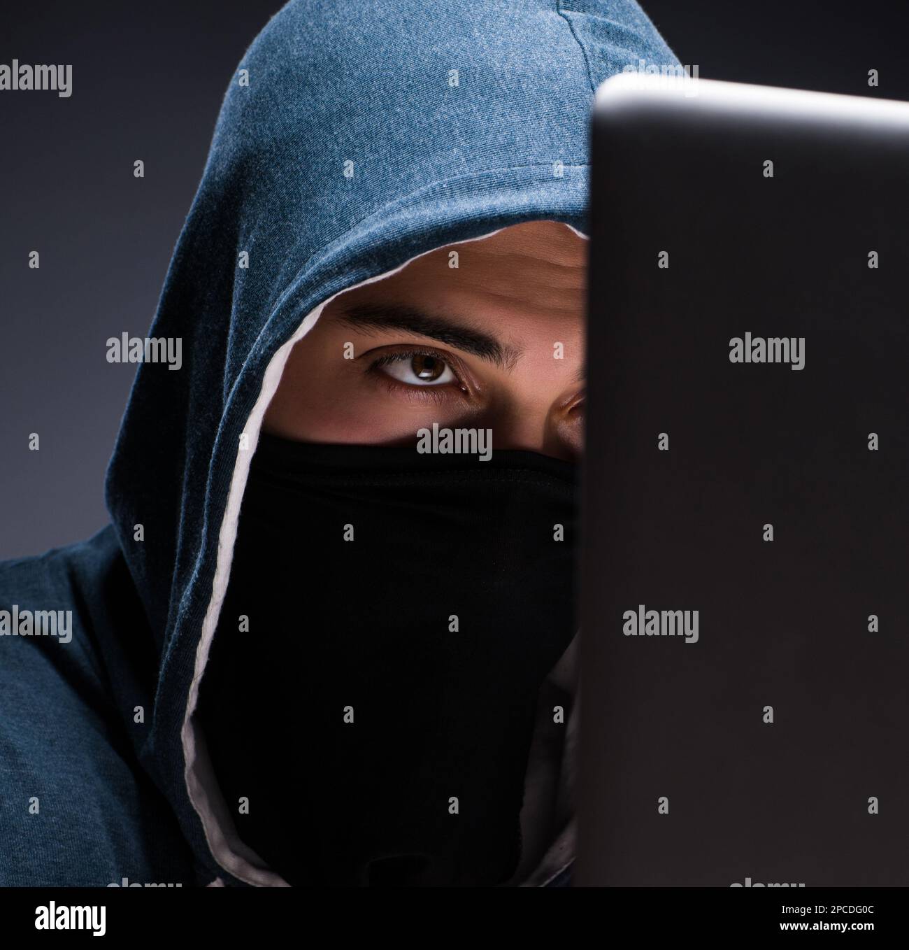 The computer hacker working in dark room Stock Photo - Alamy