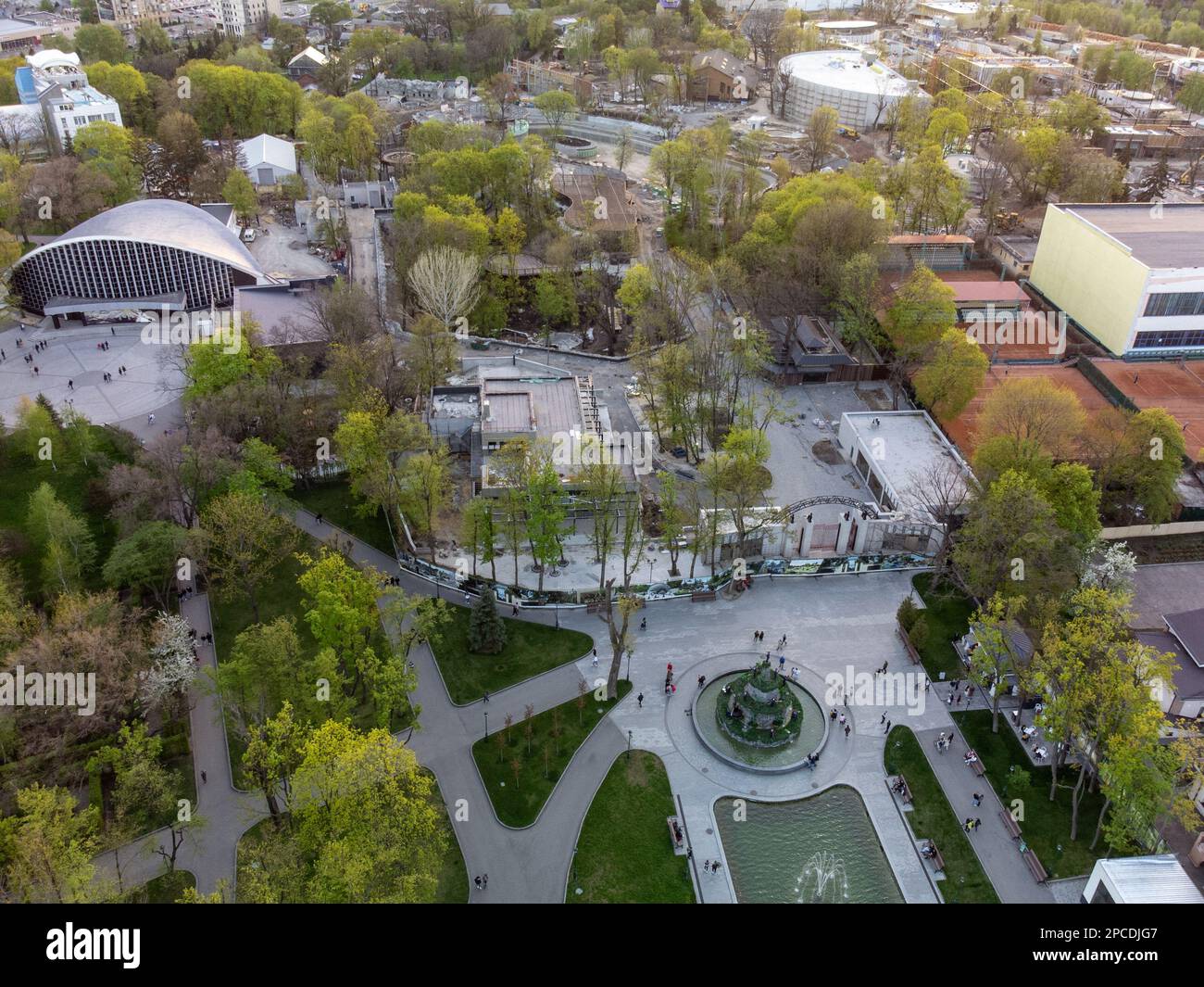 Aerial view of fountains in green spring Shevchenko park and zoo