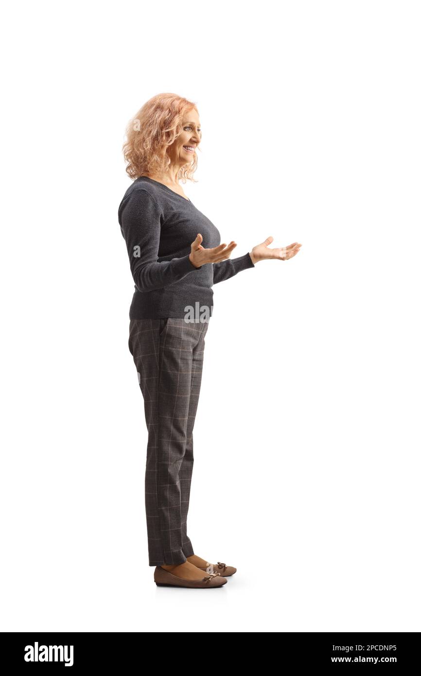 Mature woman gesturing standing hi-res stock photography and images - Alamy