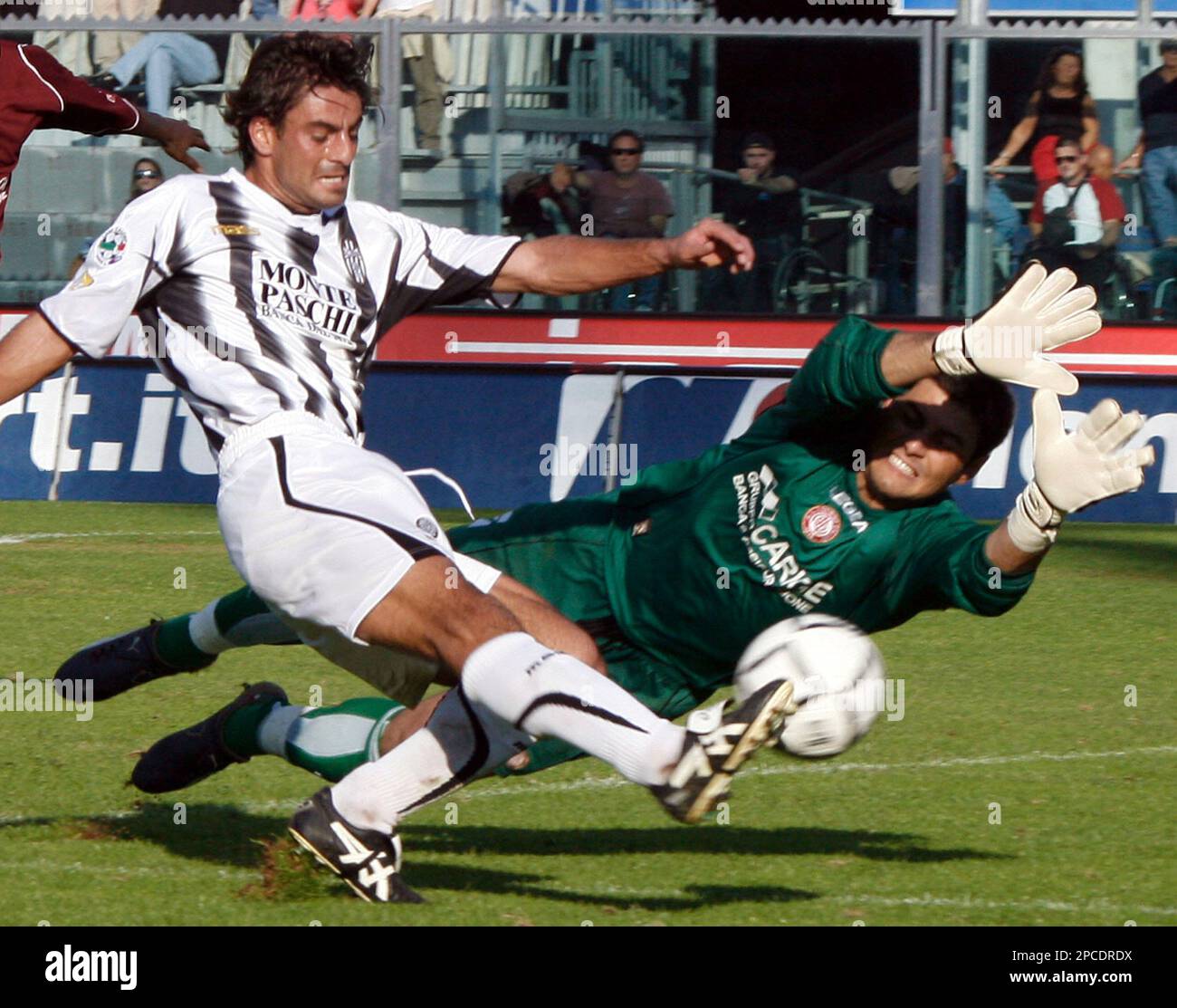 Siena's Simone Vergassola, left, tries to score past Livorno's Siena's Simone Vergassola, left, tries to score past Livorno's