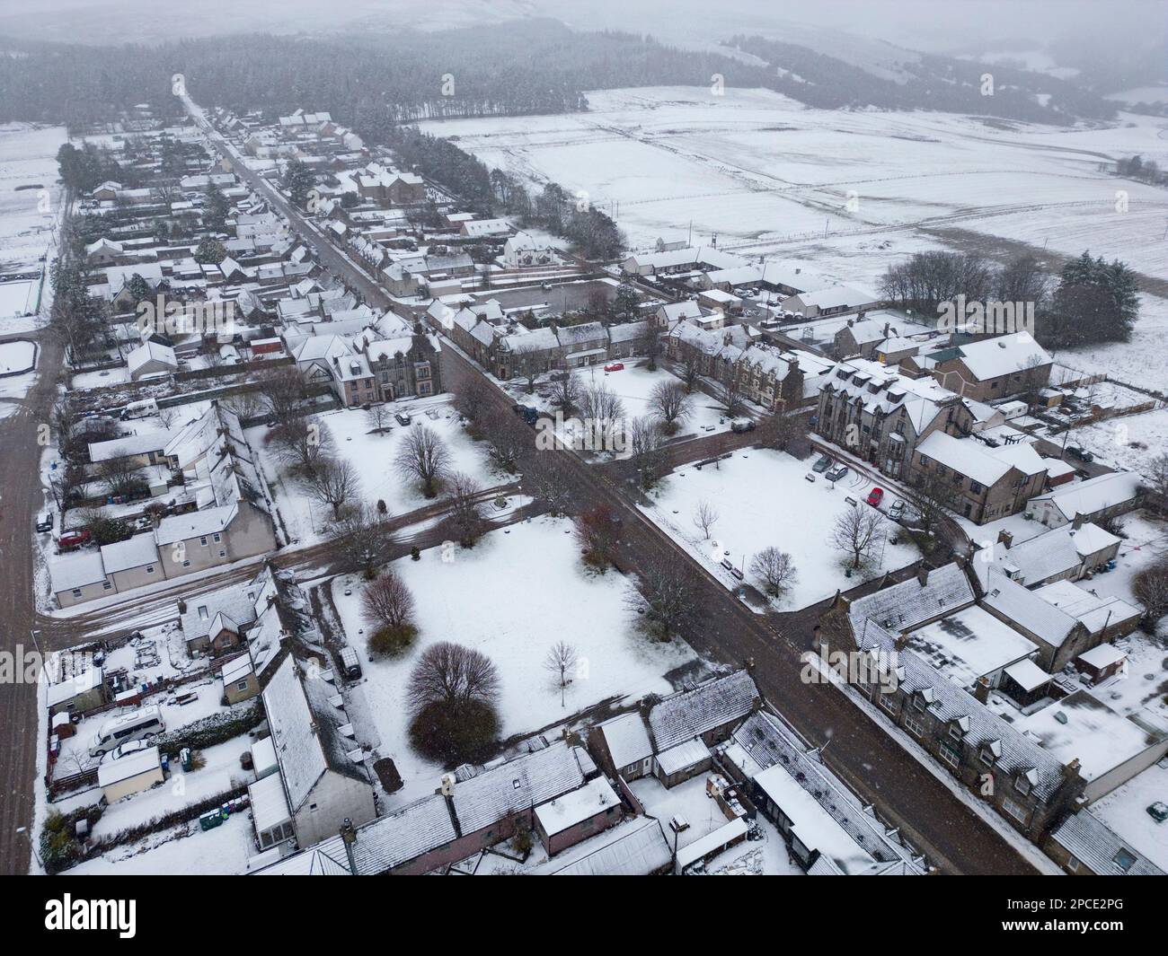 Tomintoul, Moray, Scotland, UK. 13 March 2023.  Aerial view of village square in Tomintoul in Moray covered in snow.  Scotland is expected to see heav Stock Photo