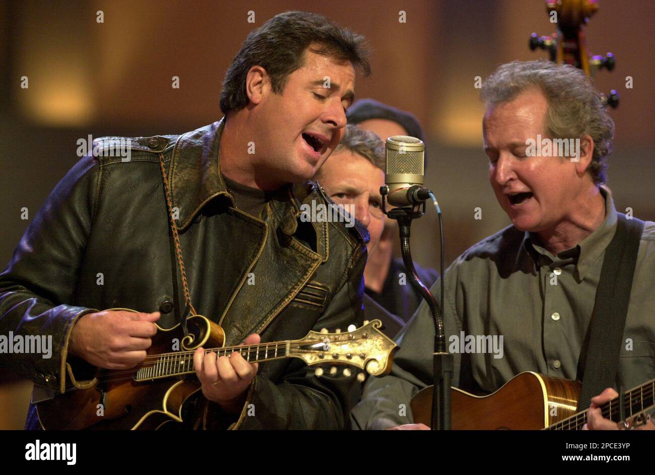 Vince Gill left performs music with guitarist Jeff White right
