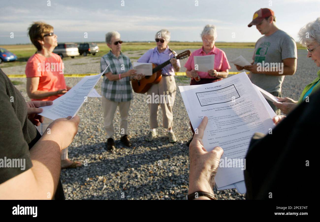 A small group of death penalty opponents gather on the grounds of the