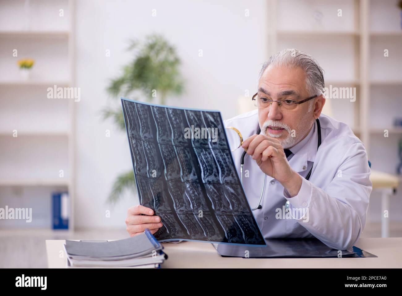 Old doctor radiologist working at the hospital Stock Photo - Alamy