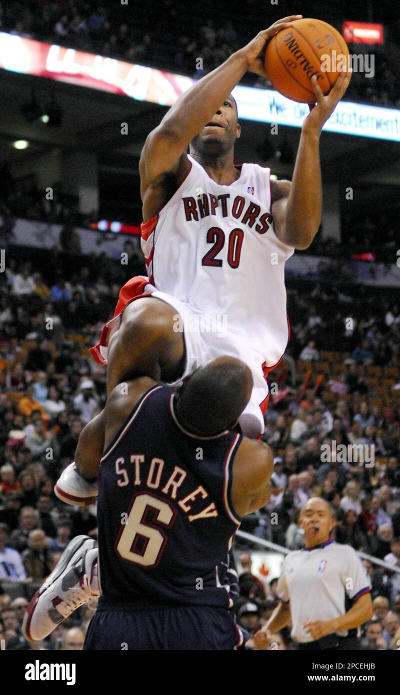 New Jersey Nets' Awvee Storey , left, fouls Cleveland Cavaliers' Jeff  McInnis as they go for a loose ball in the first quarter of a preseason  game Monday, Oct. 18, 2004, in