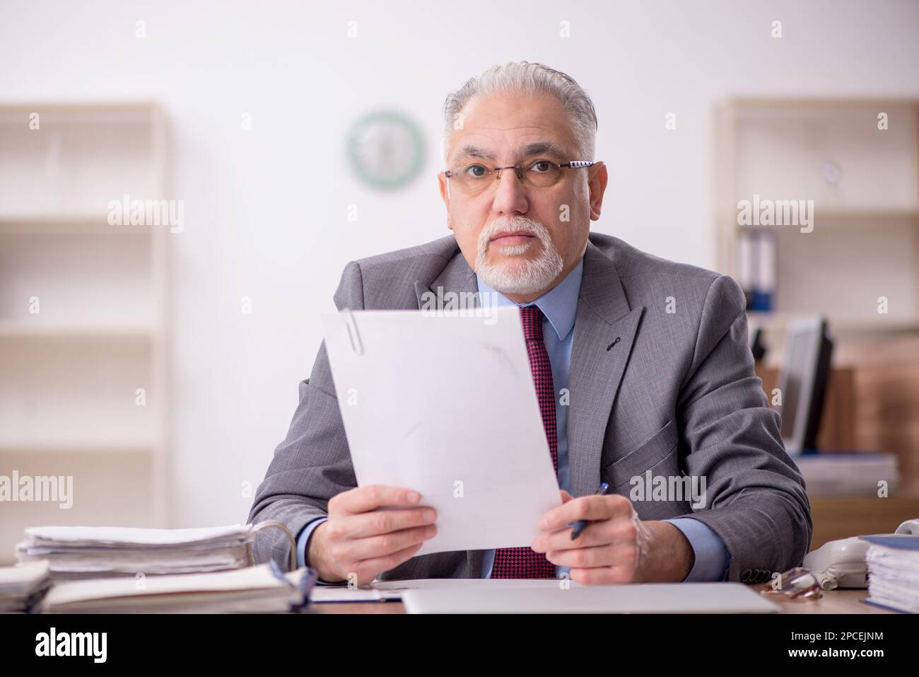 Old boss employee working at workplace Stock Photo - Alamy