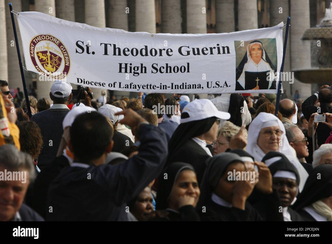Students and members of a delegation from the St. Theodore Guerin High
