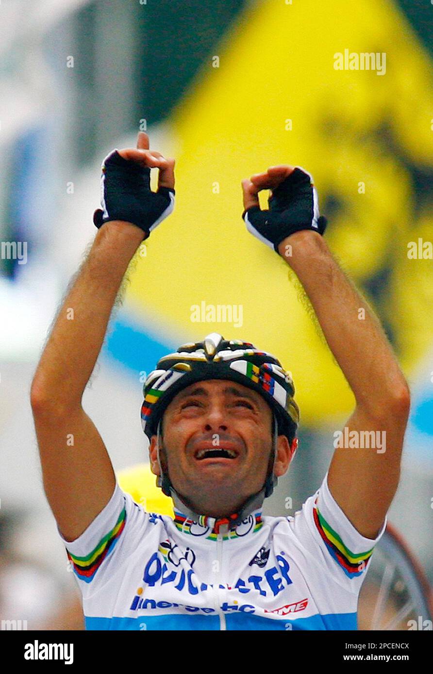 World and Olympic champion Paolo Bettini, of Italy, reacts as he