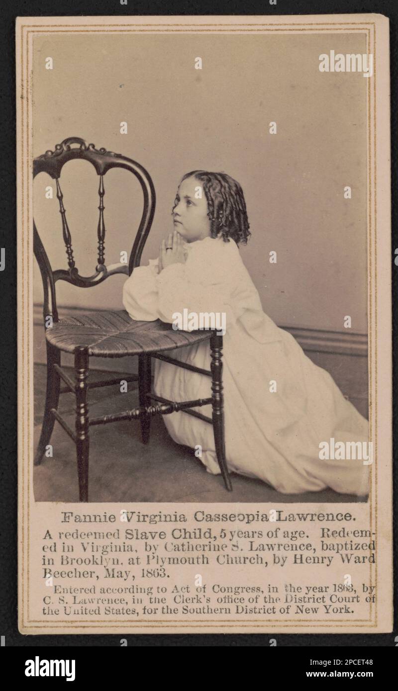 Fannie Virginia Casseopia Lawrence A redeemed slave child, 5 years of age. Redeemed in Virginia, by Catherine S. Lawrence, baptized in Brooklyn, at Plymouth Church, by Henry Ward Beecher, May, 1863 / / R.S. De Lamater, photographer, 258 Main St., Hartford Ct.. Liljenquist Family Collection of Civil War Photographs , pp/liljpaper, pp/liljwoch. Lawrence, Fannie Virginia Casseopia, African Americans, Spiritual life, 1860-1870, Girls, 1860-1870, Freedmen, 1860-1870, Prayer, 1860-1870, United States, History, Civil War, 1861-1865, Children. Stock Photo
