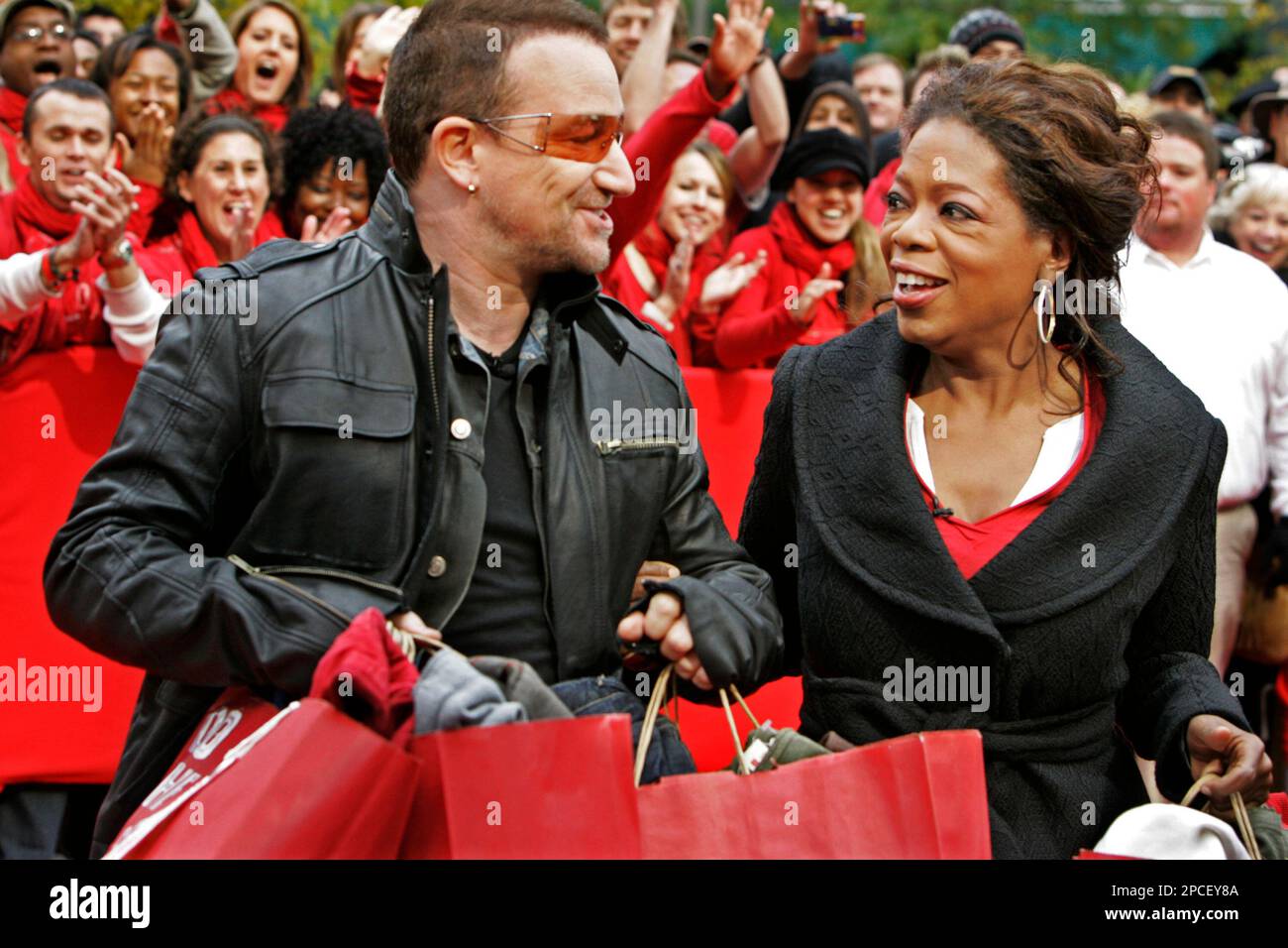 Irish rocker Bono, frontman for U2, and talk show host Oprah Winfrey leave  a Gap store on Chicago's "Magnificent Mile" after a shopping spree  Thursday, Oct. 12, 2006. Oprah joined Bono to