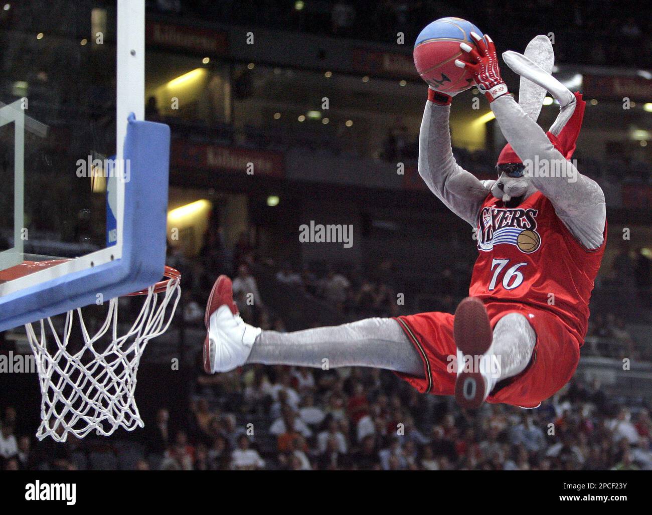 Hip Hop, mascot of the Philadelphia 76ers, throws a dunking during 
