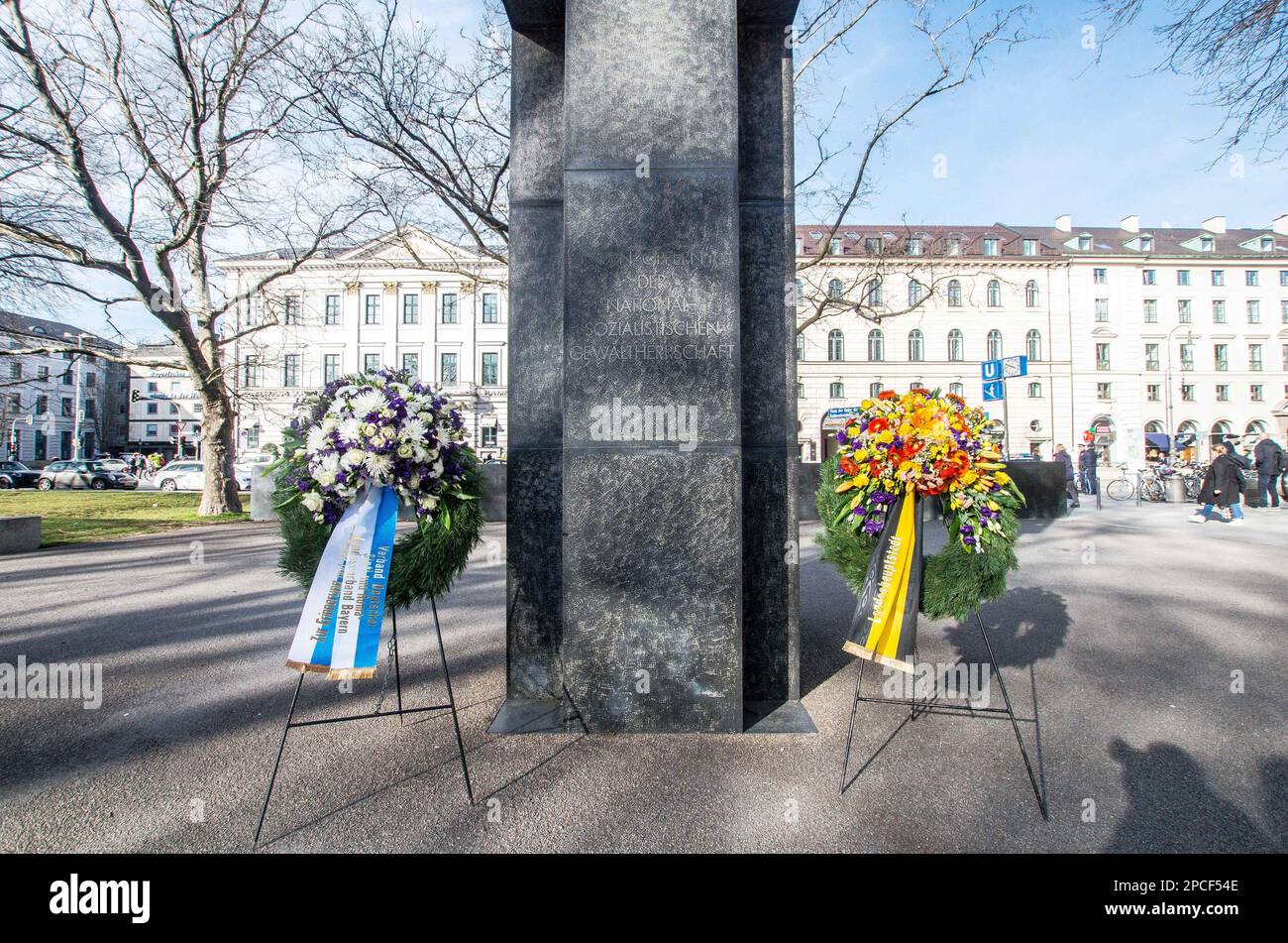 March 13, 2023, Munich, Bavaria, Germany: Assembling at the Platz der Opfer des Nationalsozialismus (Plaza for the Victims of National Socialism) in Munich, Germany, Director CAROLINE LINK, FC-Bayern President HERBERT HAINER, Munich Deputy Mayor KATRIN HABERSCHADEN of the Greens, and MEHMET DAIMAGÃœLER, Federal Commissioner Against Antiziganism assembled together to memorialize the 80th anniversary of the deportations of Sinti and Roma from Munich. Some research indicates the ultimate death toll of Roma to be between 1.5 and 2 million with many along the way having been funneled into human exp Stock Photo
