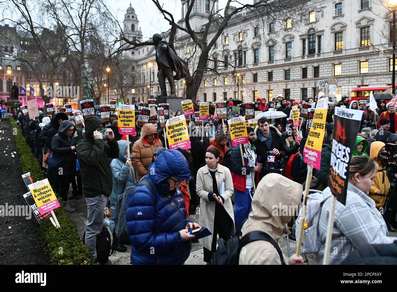 London, UK. 13th Mar, 2023. Crowds of protesters seen gathered in Parliament Square, with placards and banners during a pro-migration rally in London. Pro migration activists gathered in Parliament Square, today evening to protest against the proposed Nationality and Borders bill, which if enacted, will make sweeping changes to way the UK authorities handle migrants, refugees and asylum seekers. Credit: SOPA Images Limited/Alamy Live News Stock Photo