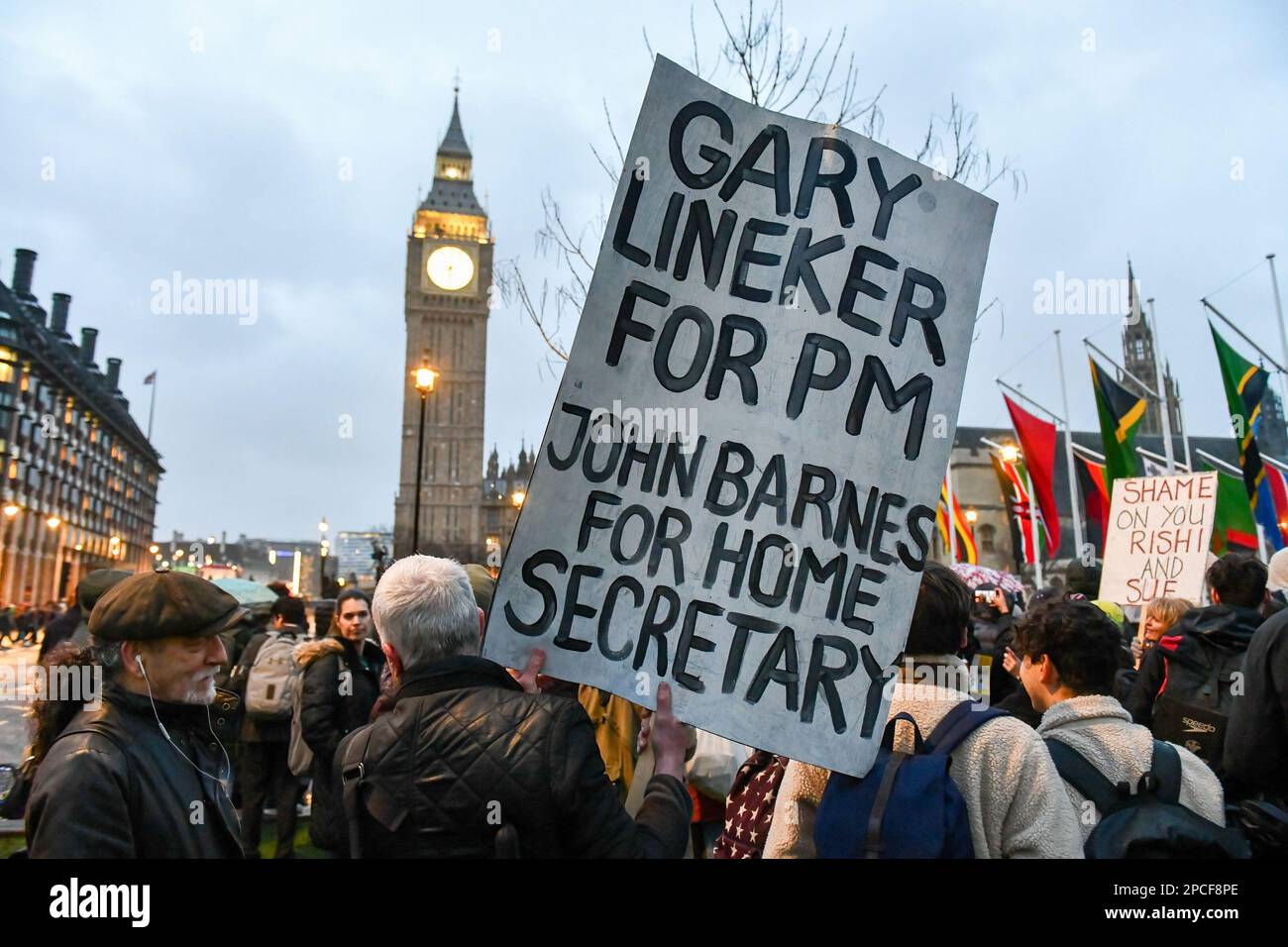 A protester holds a placard in support of football pundit Gary Lineker who has been at the centre of controversy after his comments about UK government policy which led to his suspension by the BBC, during a pro-migration rally in Parliament Square, London. Pro migration activists gathered in Parliament Square, today evening to protest against the proposed Nationality and Borders bill, which if enacted, will make sweeping changes to way the UK authorities handle migrants, refugees and asylum seekers. (Photo by Mike Ruane/SOPA Images/Sipa USA) Stock Photo