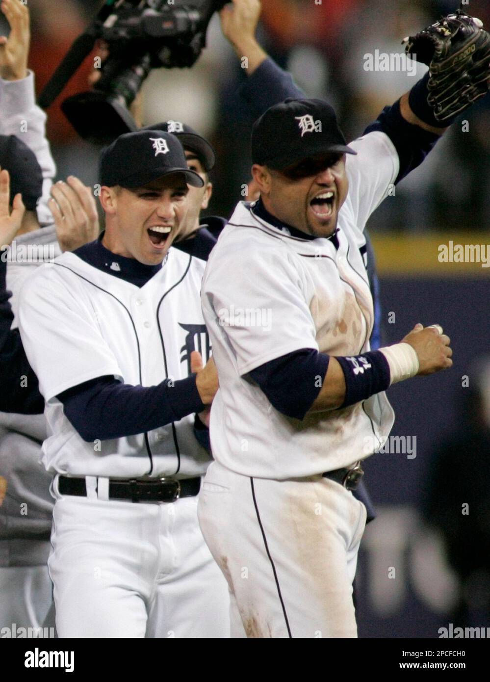 Detroit Tigers' Placido Polanco, right, is congratulated by Miguel Cabrera  after scoring in the third inning of a baseball game against the Kansas  City Royals, Saturday, Aug. 30, 2008, in Detroit. (AP