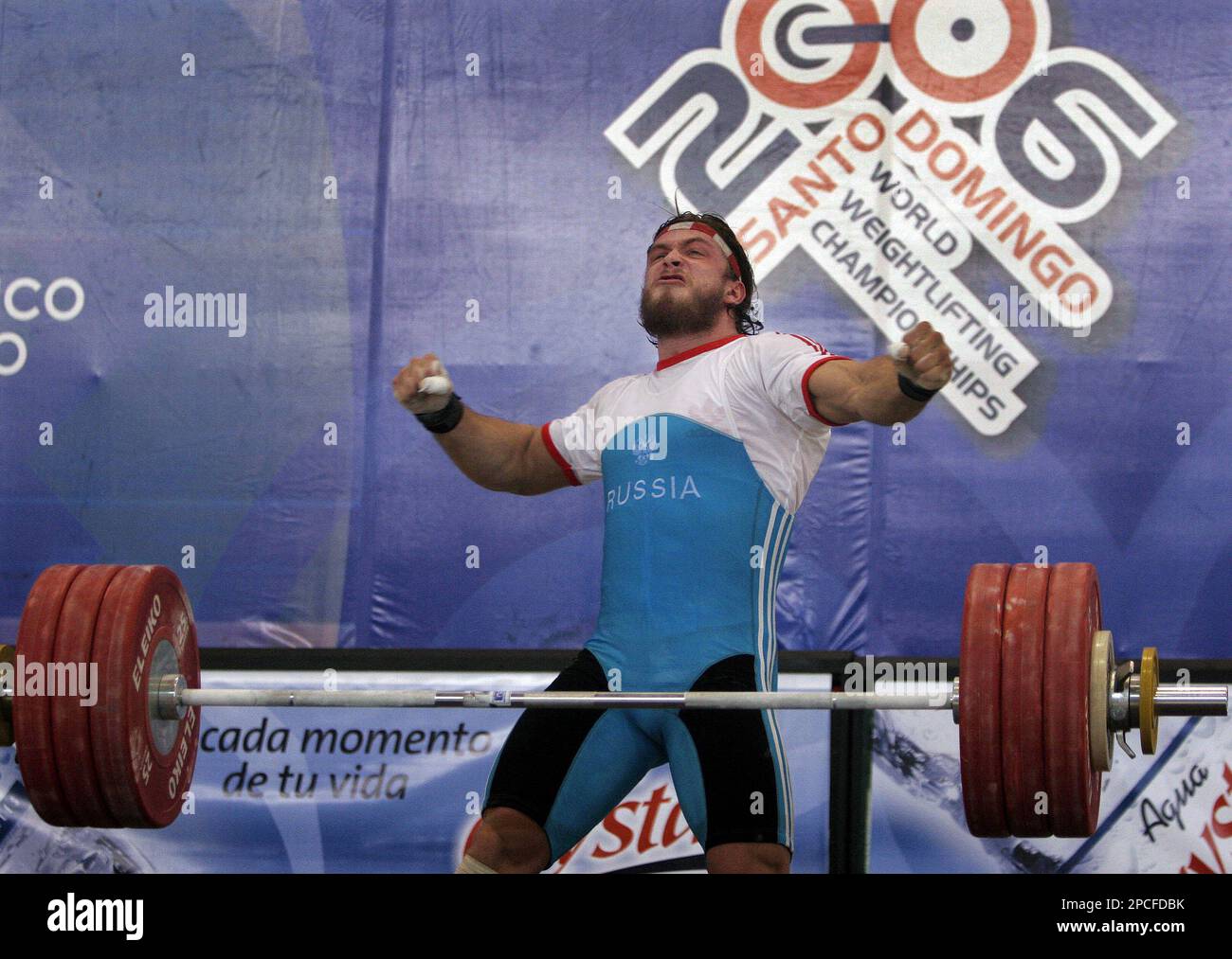 Russia s Dmitry Klokov celebrates after his succesful lift of 188 kg. 414 lbs. to win the bronze medal in the snatch modality of the men s 105 kg. 231 lbs. category at the