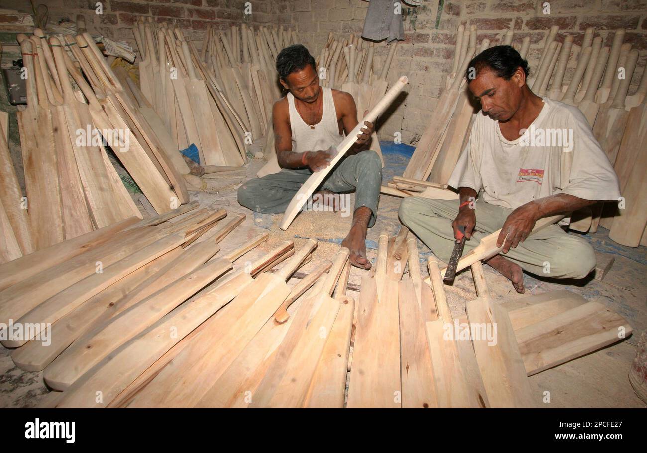 Workers make cricket bats at a factory in Jalandhar, in the northern
