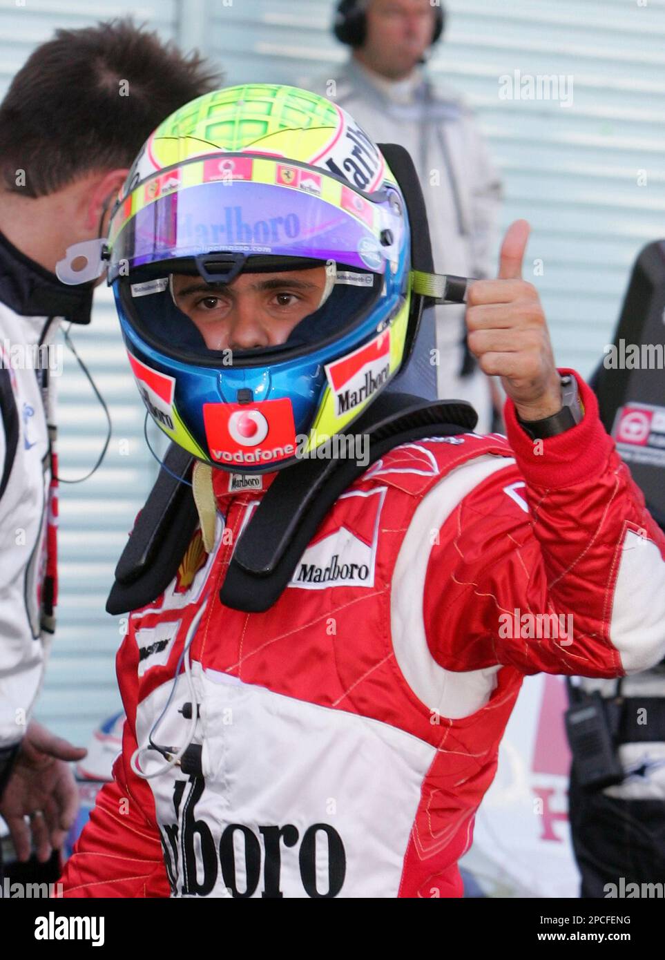 Brazilian driver Felipe Massa shows a thumbs-up as he gets off his Ferrari  after qualifying for Sunday's Formula One Japanese Grand Prix at the Suzuka  Circuit in Suzuka, central Japan, Saturday, Oct.