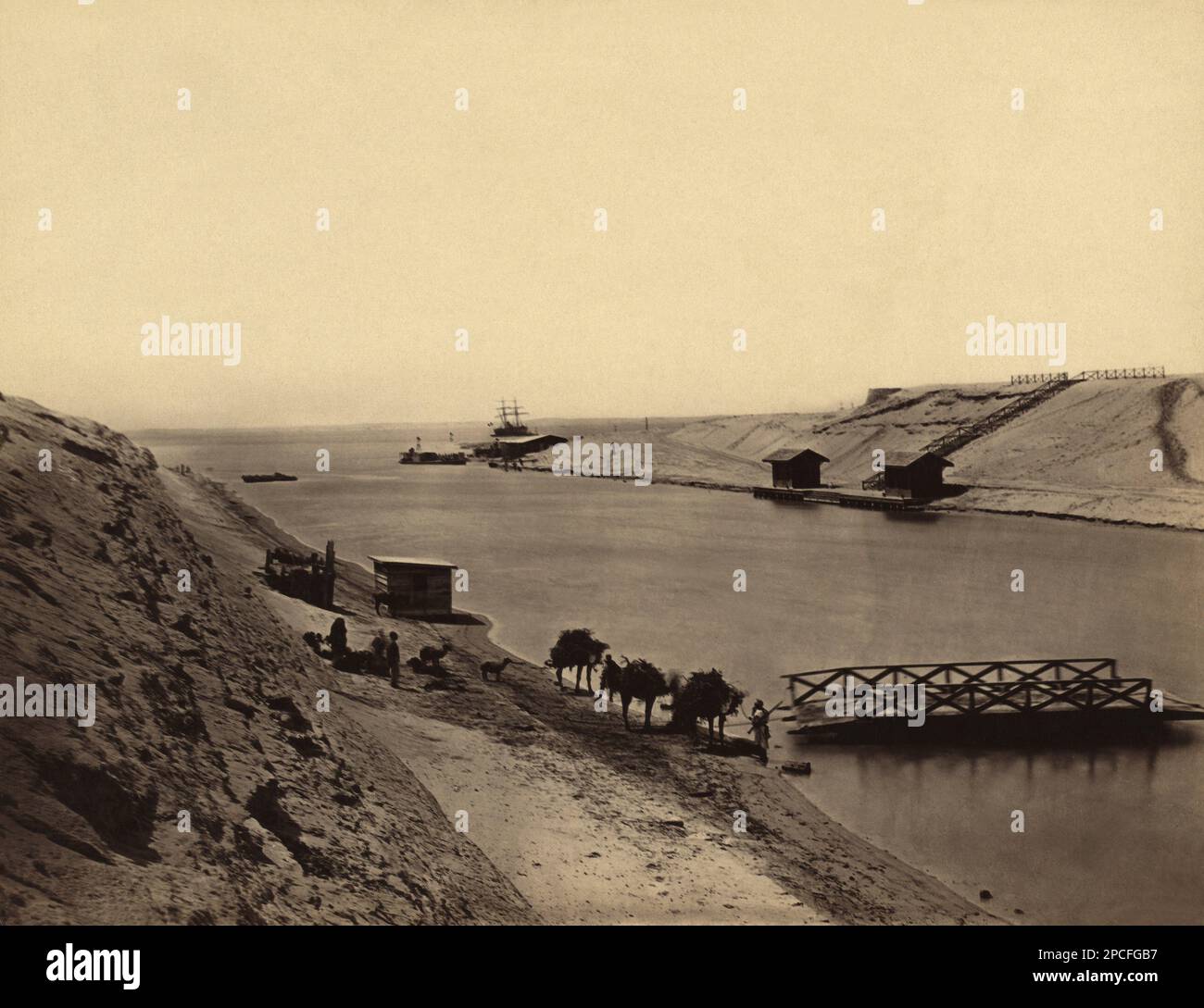 1860 ca, SUEZ , EGYPT:  The SUEZ CANAL . Lake Timsah , from opposite the Chalet of the Viceroy . Photo by Francis Frith . Opened in November 1869, it allows water transportation between Europe and Asia without navigating around Africa or carrying goods overland between the Mediterranean and the Red Sea. The northern terminus is Port Said, with the southern terminus being near Suez. Ismailia is located halfway between Port Said and Suez . The canal is owned and maintained by the Suez Canal Authority (SCA) of the Arab Republic of Egypt . - ITALIA  - GEOGRAPHY - GEOGRAFIA - FOTO STORICHE - HISTOR Stock Photo