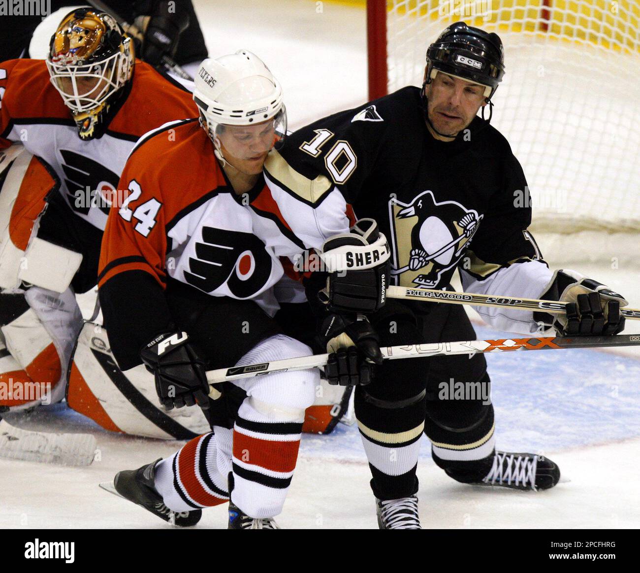 Pittsburgh Penguins' John LeClair (10) gets congratulated on his  second-period goal by teammate Sidney Crosby (87) during the Penguins' NHL  hockey game against the Carolina Hurricanes Friday, Feb. 10, 2006, in  Raleigh