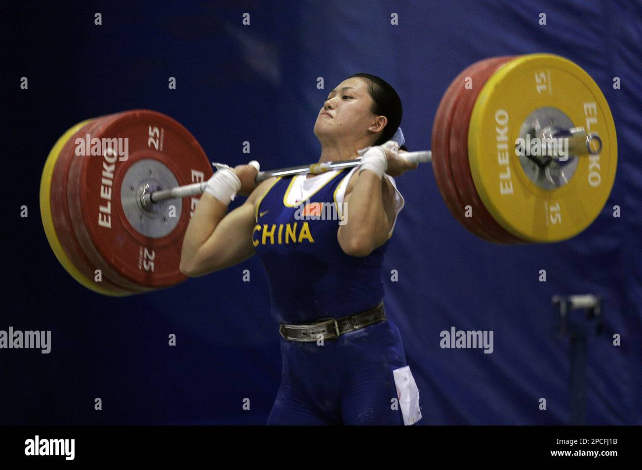 China’s Cao Lei lifts 150kg (331 lbs) to win the gold medal in the 