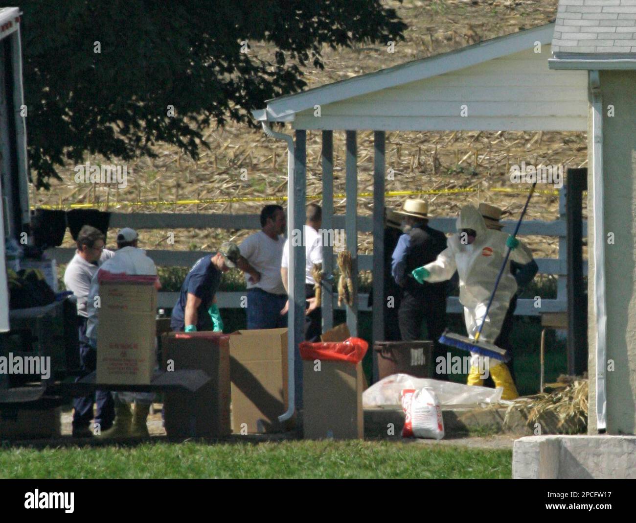 A person is seen cleaning at a schoolhouse Tuesday, Oct. 3