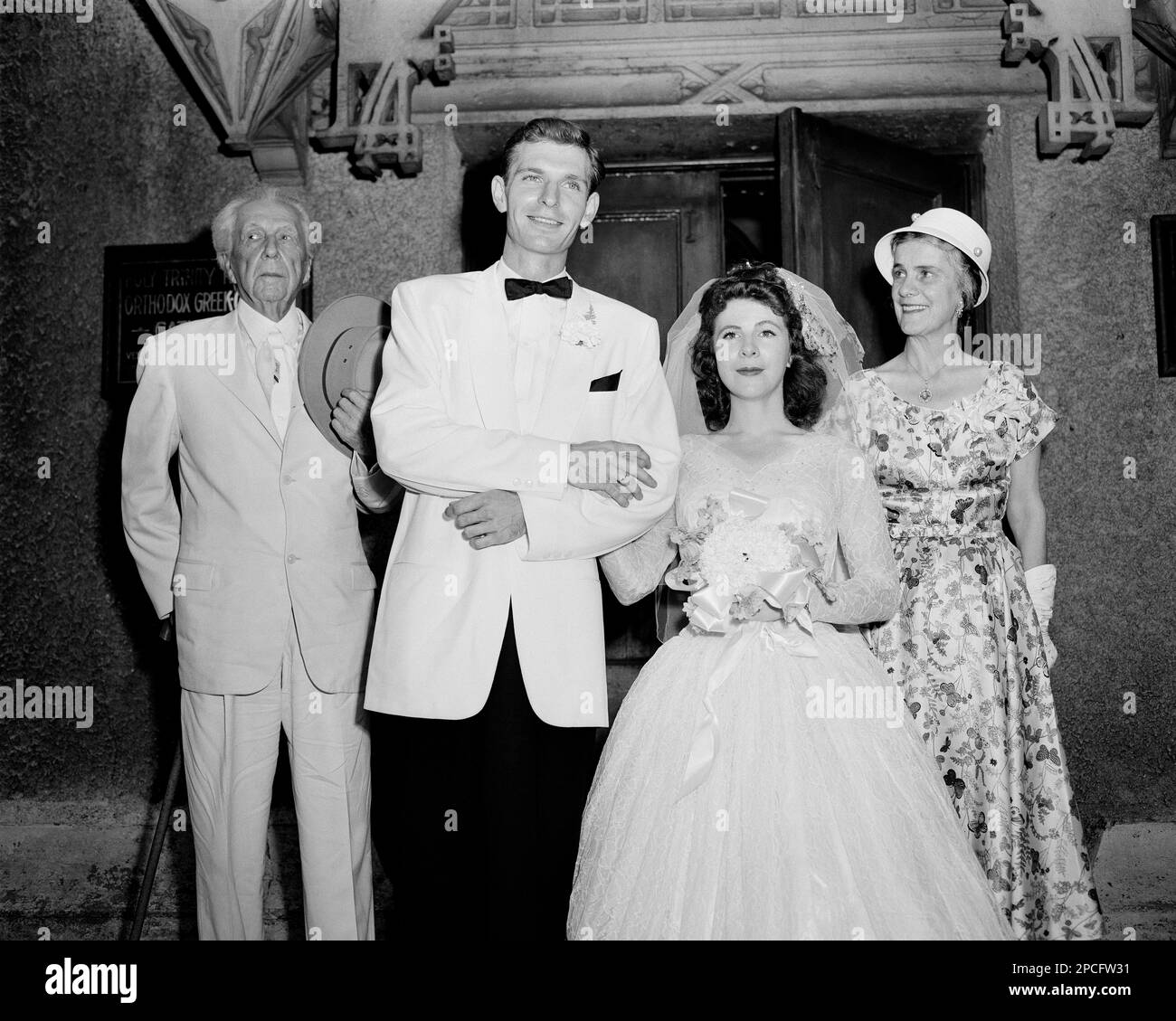 Architect Frank Lloyd Wright, left, and his wife Olgivanna, right, pose