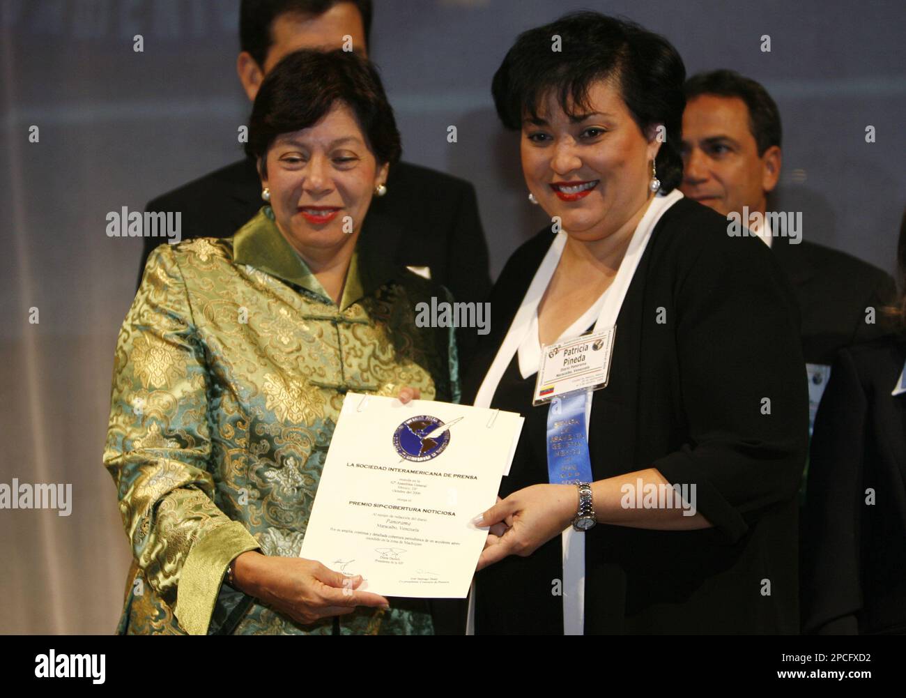Diana Daniels, left, President of the Interamerican Press Society, SIP,  gives the SIP best spot news coverage award to Patricia Pineda,  representing the newspaper Panorama of Maracaibo, Venezuela for its  coverage of