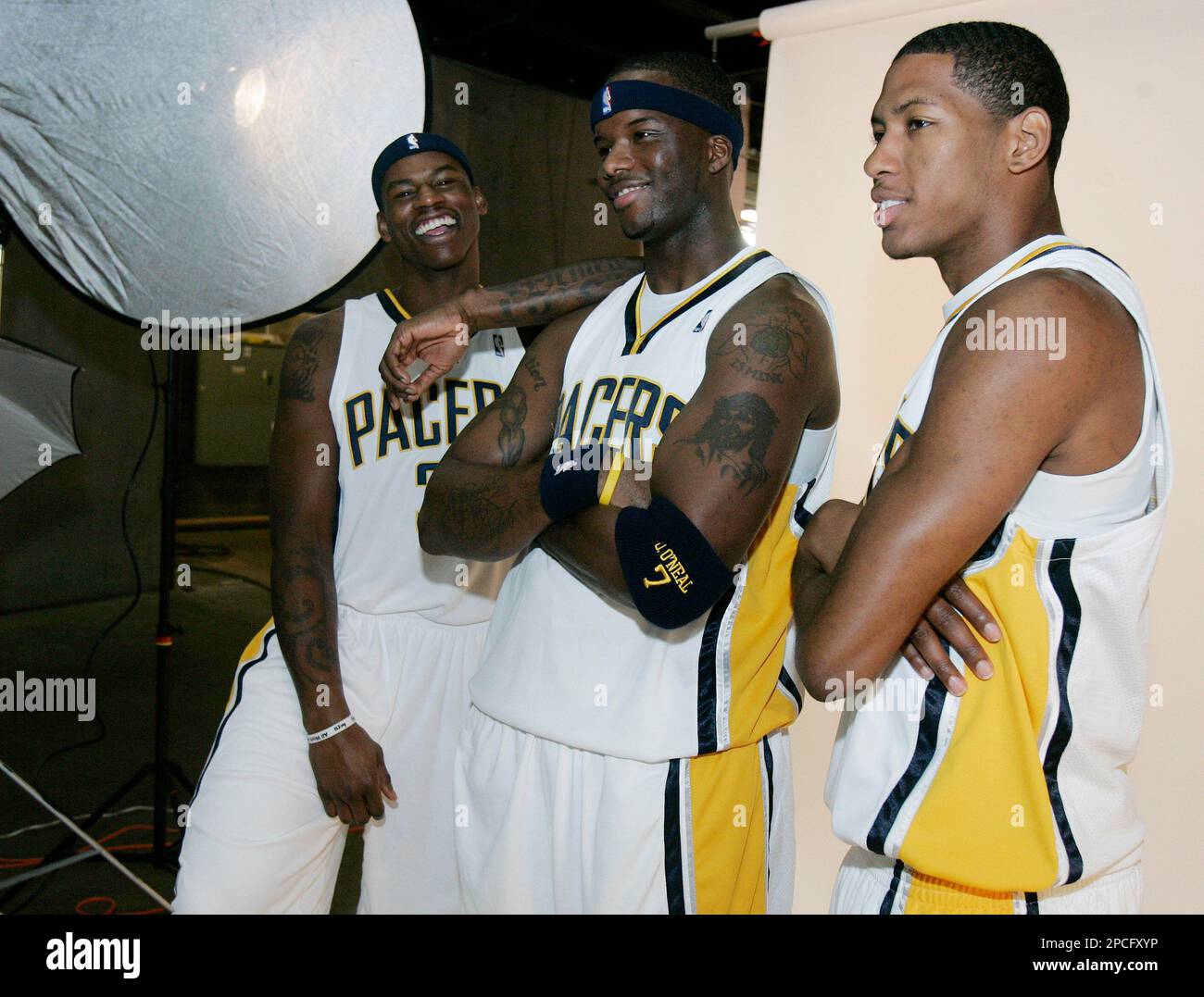 From left, Indiana Pacers' Al Harrington, Jermaine O'Neal and Danny Granger  wait to be photographed during media day in Indianapolis, Monday, Oct. 2,  2006. (AP Photo/Darron Cummings Stock Photo - Alamy