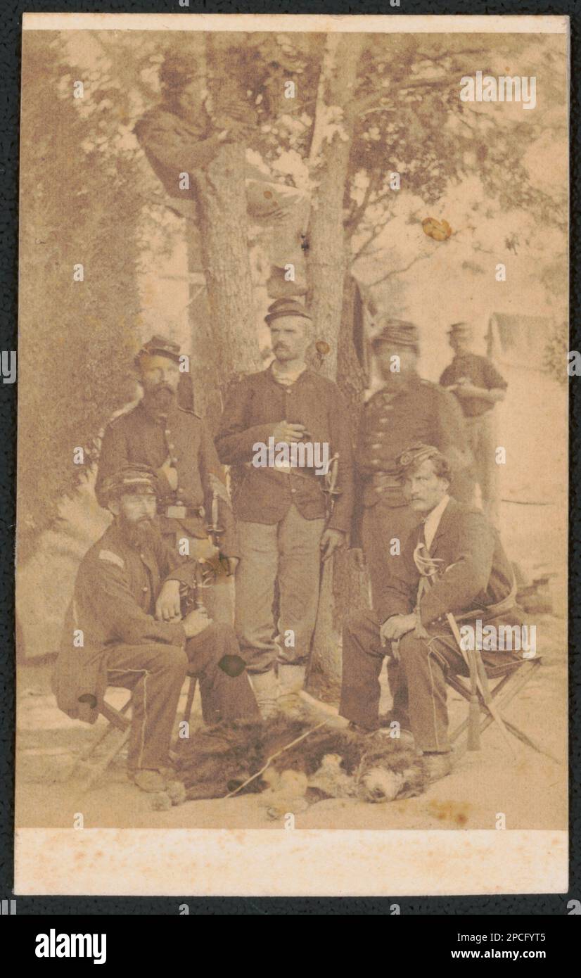 Second Lieutenant George Kannig of Co. C and Co. K, 29th New York Infantry Regiment , First Lieutenant Emil Schluter of Co. I, Co. K and Co. E, 29th New York Infantry Regiment, and Captain Charles William Chelius of Co. C and Co. E, 29th New York Infantry Regiment and unidentified soldiers in uniform with swords and a dog. Liljenquist Family Collection of Civil War Photographs , pp/liljpaper. Kannig, George, approximately 1826- , Schluter, Emil, approximately 1825-1886, Chelius, Charles William, approximately 1839- , United States, Army, New York Infantry Regiment, 29th (1861-1863), People, So Stock Photo