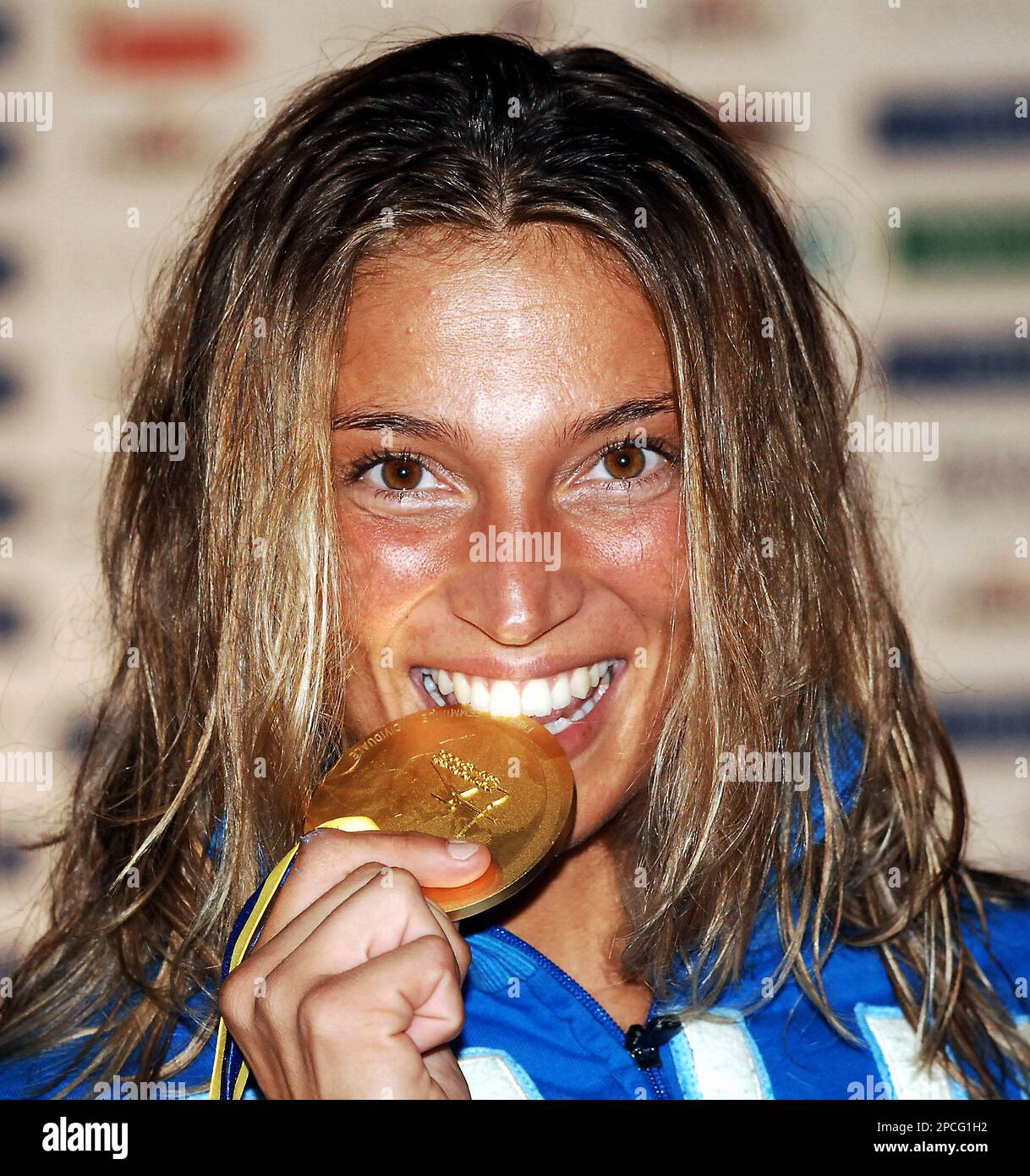Italy s Margherita Granbassi Bites Her Gold Medal As She Celebrates On italy-s-margherita-granbassi-bites-her-gold-medal-as-she-celebrates-on