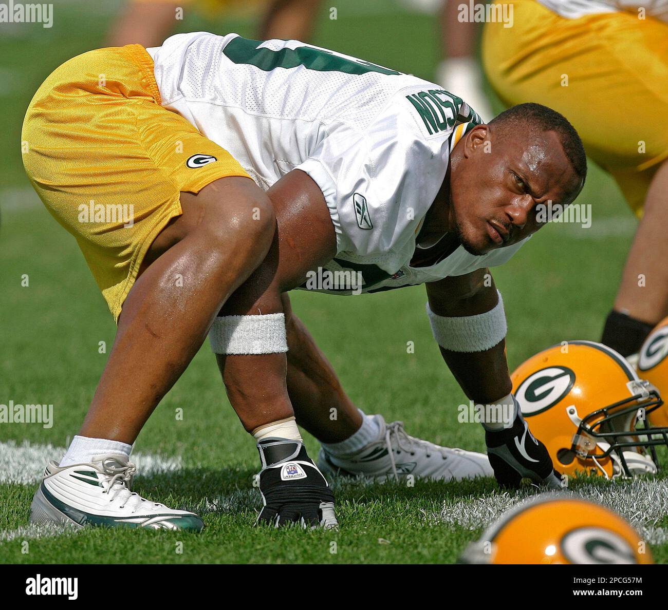 FILE **Green Bay Packers fullback William Henderson stretches at football  training camp Aug. 1, 2006, in Green Bay, Wis. Henderson, a fixture in the Green  Bay Packers' backfield since their Super