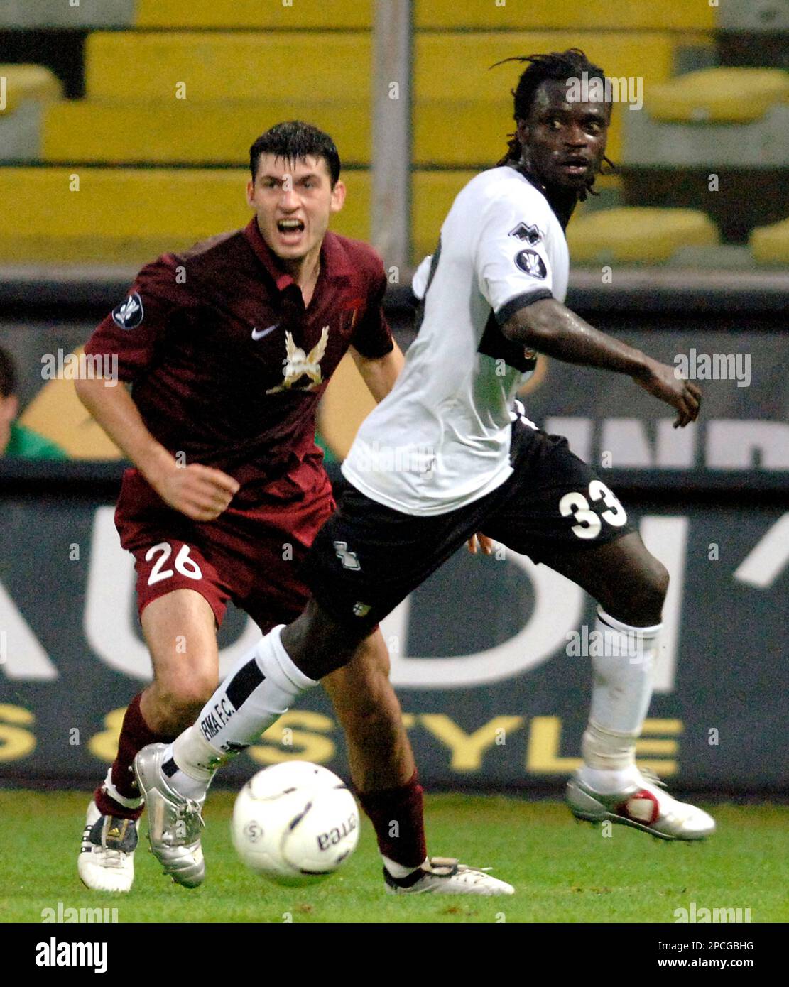 Rubin Kazan's Aleksandr Gatskan, left, and Parma's Ferdinand Coly in action  during the UEFA Cup first round, second-leg, soccer match between Parma and  Rubin Kazan, in Parma's Ennio Tardini stadium, northern Italy,