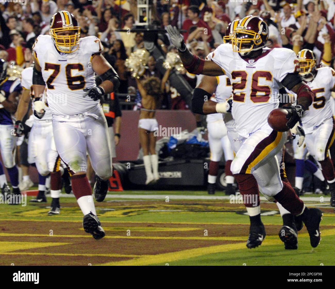 FILE ** Washington Redskins offensive tackle Jon Jansen (76), left, follows  running back Clinton Portis (26) after Portis scored a touchdown against  the Minnesota Vikings in Landover, Md. in this Sept.