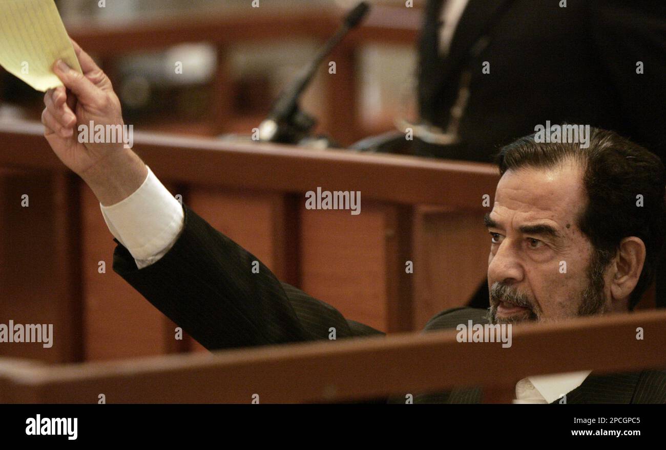 Saddam Hussein argues with the judge during his trial in Baghdad, Iraq ...