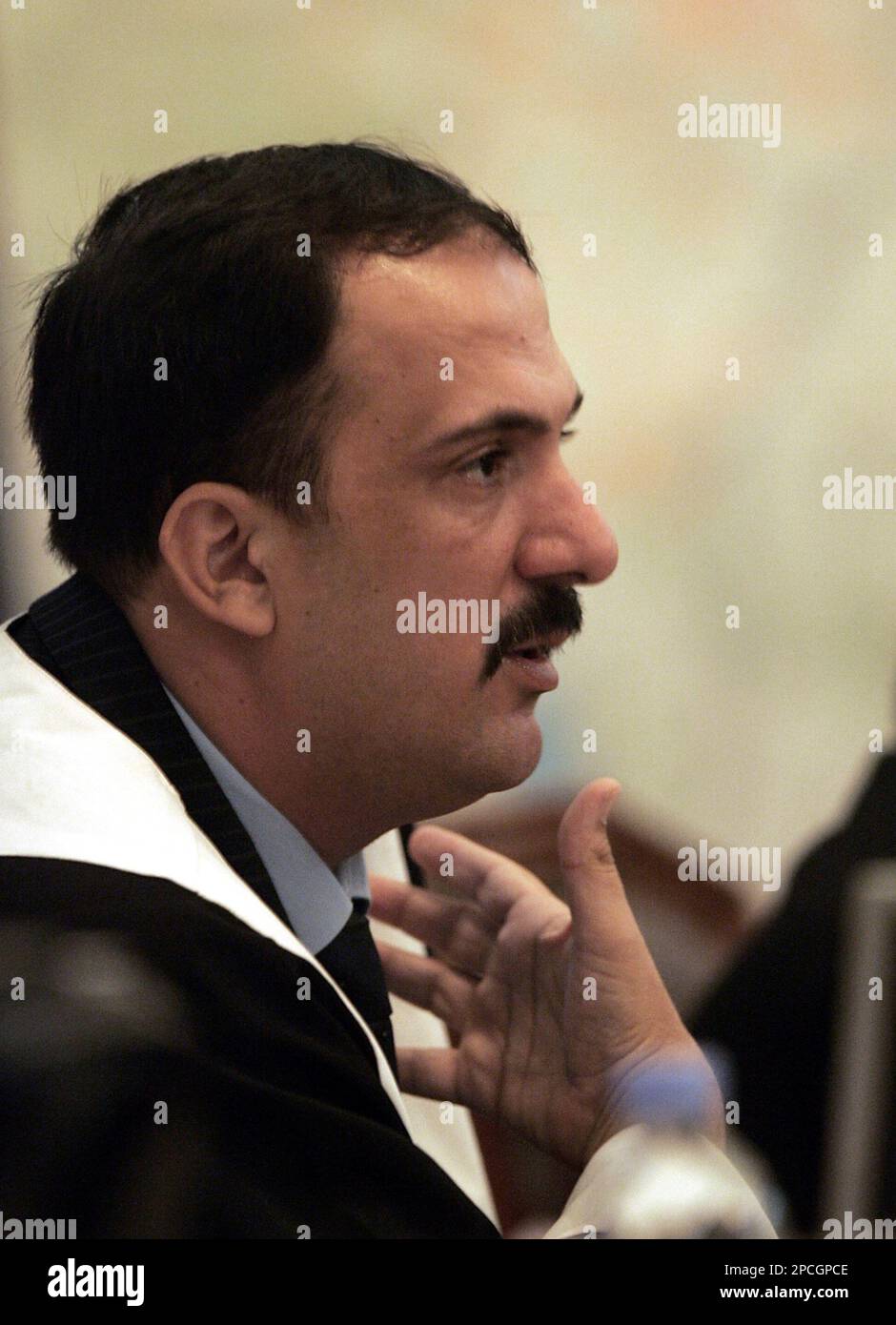 The chief judge Mohammed Oreibi al-Khalifa, presides over the trial of ...