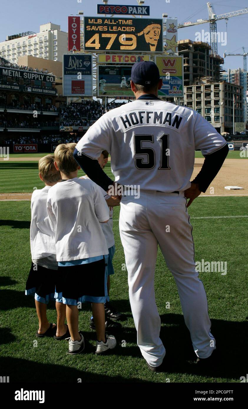 San Diego Padres closer Trevor Hoffman and his three sons watch a tribute  to his career on the scoreboard screen at PETCO Park after Hoffman became  baseball's all-time save leader in the
