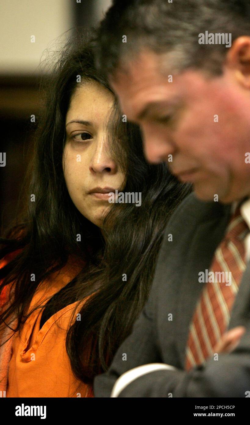 Shannon Torrez and her attorney Daniel Briegel listen to the judge