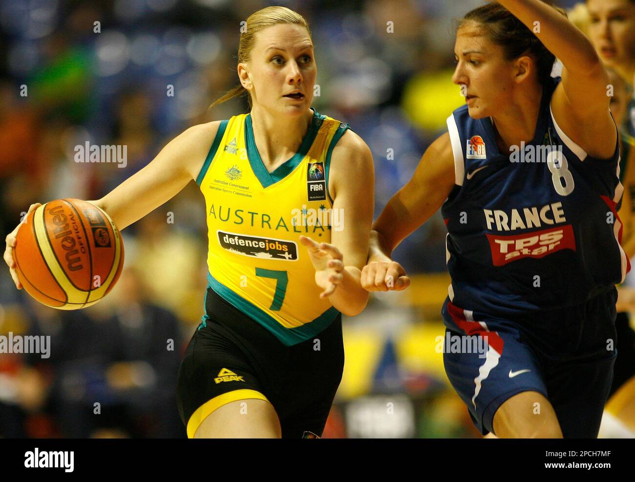 Australia's Penelope Taylor tries to drive past France's Emmanuelle