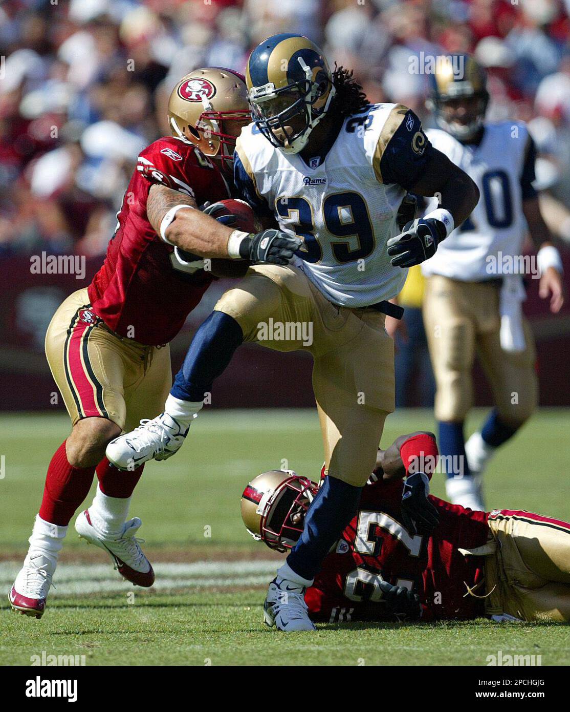 San Francisco 49ers Jeff Ulbrich fends off Atlanta Falcons Warrick