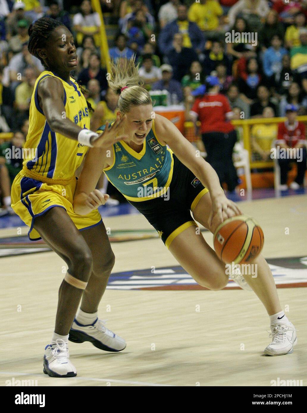 Australia's Penelope Taylor, right, drives to the basket against Brazil