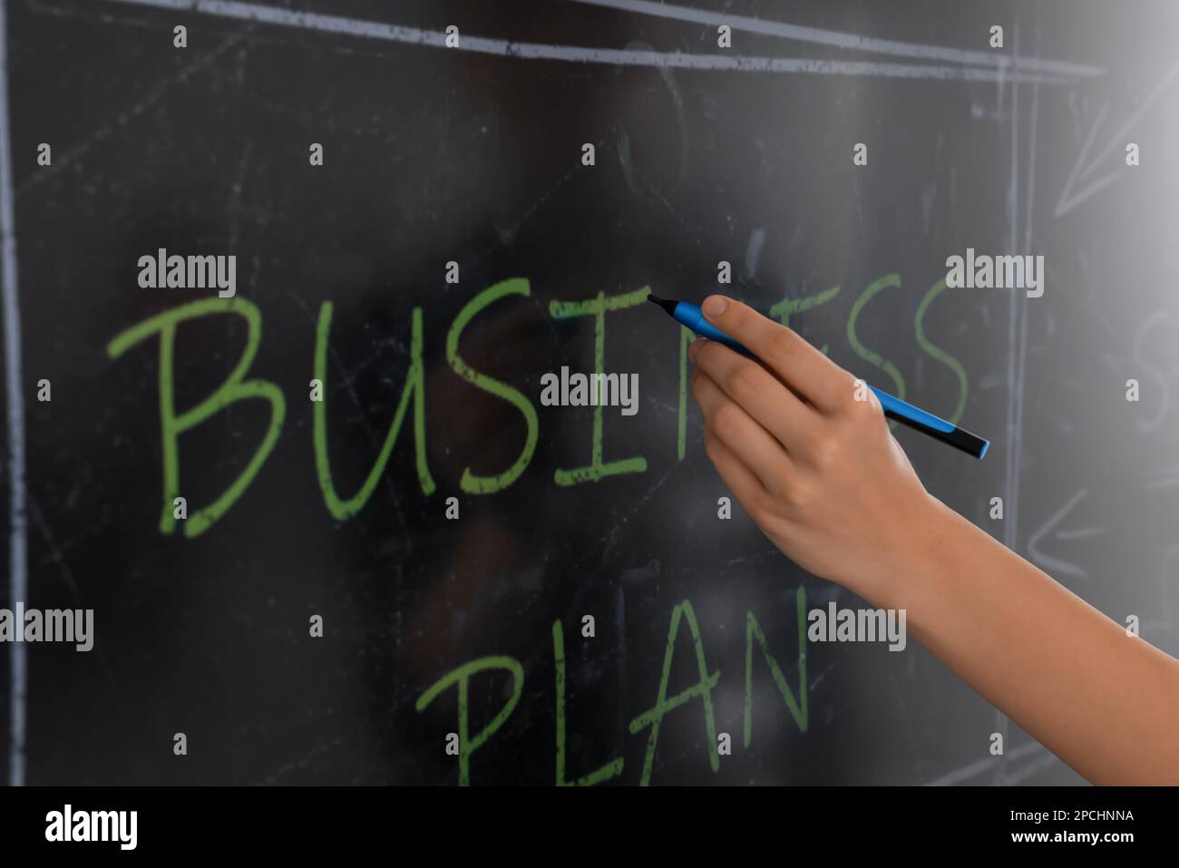 Business trainer with pen using interactive board, closeup Stock Photo