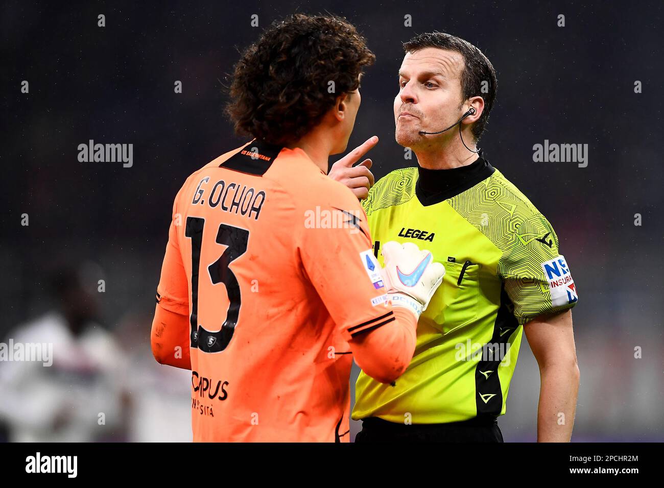 Milan, Italy. 13 March 2023. Referee Federico La Penna argues with Guillermo Ochoa of US Salernitana during the Serie A football match between AC Milan and US Salernitana. Credit: Nicolò Campo/Alamy Live News Stock Photo