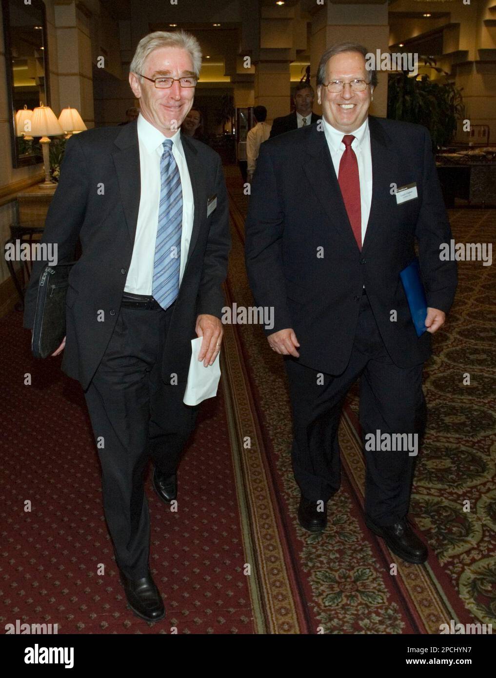 Iamgold CEO Joseph Conway, left, and Louis Gignac, CEO of Montreal-based Cambior leave a presentation in Toronto, Thursday, Sept. 14, 2006. IAMGold Corp. said Thursday it is buying a rival Canadian miner, Cambior Inc., for $1.1 billion in stock to create a company capable of producing more than 1 million ounces of gold per year. (AP Photo/CP, Adrian Wyld) Stock Photo