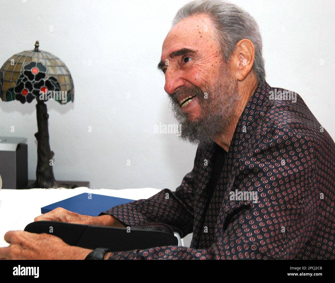 Cuba's leader Fidel Castro is seen during a meeting with Argentine Congressman Miguel Bonasso in Havana, Wednesday, Sept. 13, 2006. Castro made an appearance of sorts Wednesday on the sidelines of the Nonaligned Movement summit when Cuban state television showed photos of him wearing pajamas and chatting with a close friend from Argentina. (AP Photo/NOAL Summit, Pool) Stock Photo