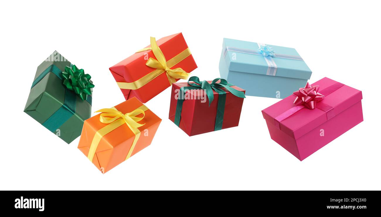 Beautifully wrapped gift boxes flying on white background Stock Photo
