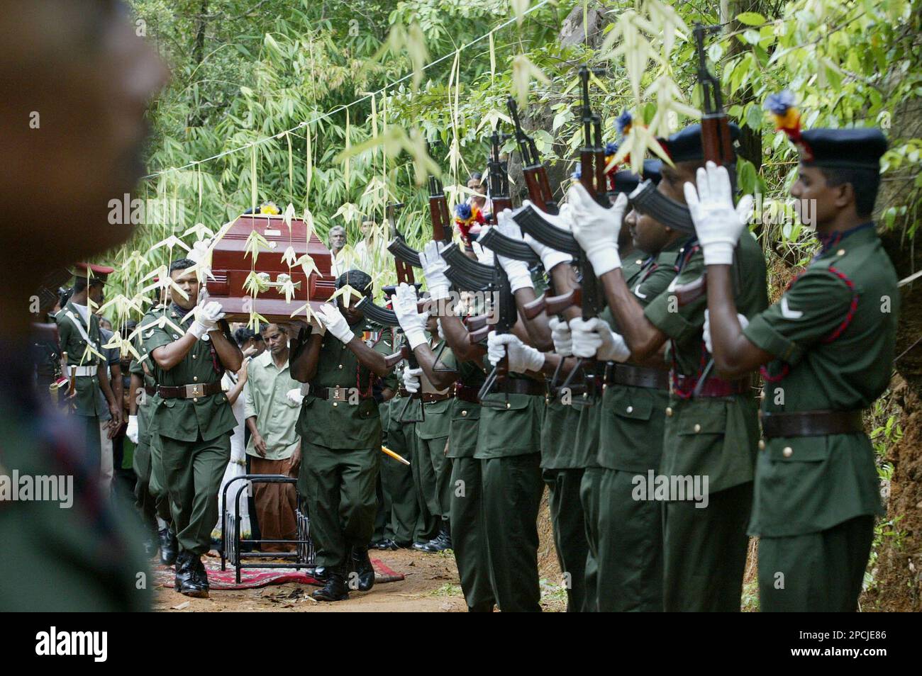 Soldiers carry the remains of fellow soldier priyantha indunil during
