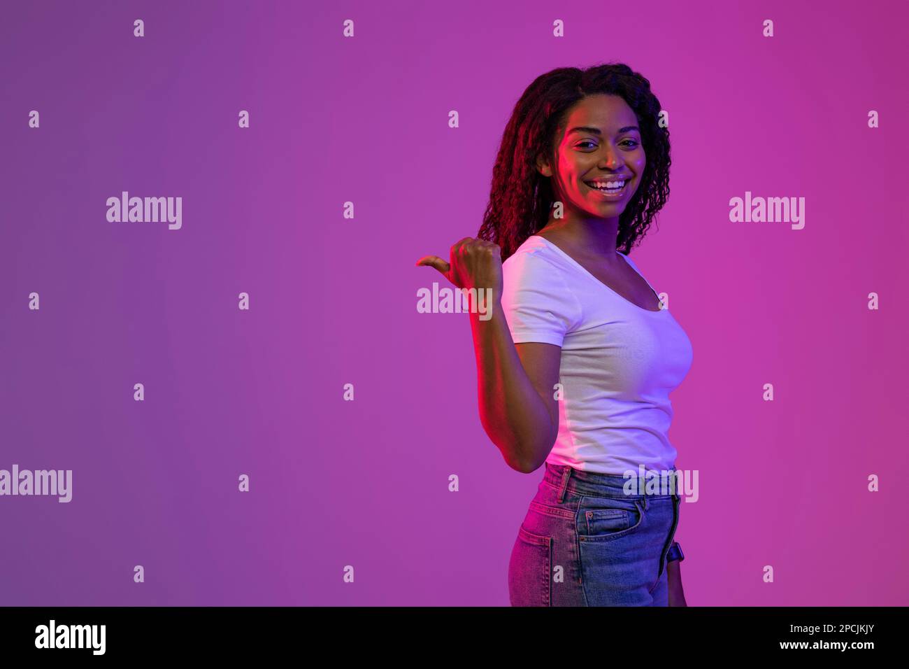 Happy Black Woman Pointing At Copy Space Behind Her Back Stock Photo ...