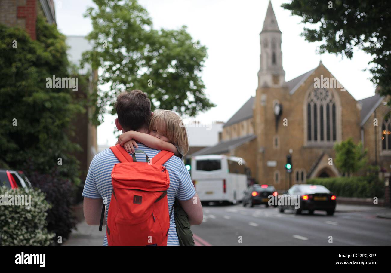 Father carrying son in London Stock Photo